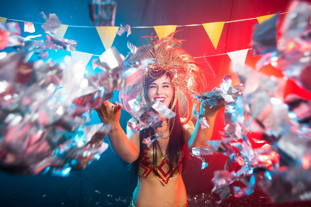 Holidays, party, dance and nightlife concept - Beautiful woman dressed for carnival night